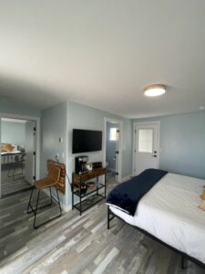 Interior of the 2-bedroom suite with a king bed at The Homestead Palisade, featuring stylish decor and comfortable furnishings.