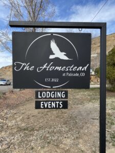 The Homestead at Palisade, CO sign. Lodging and events.