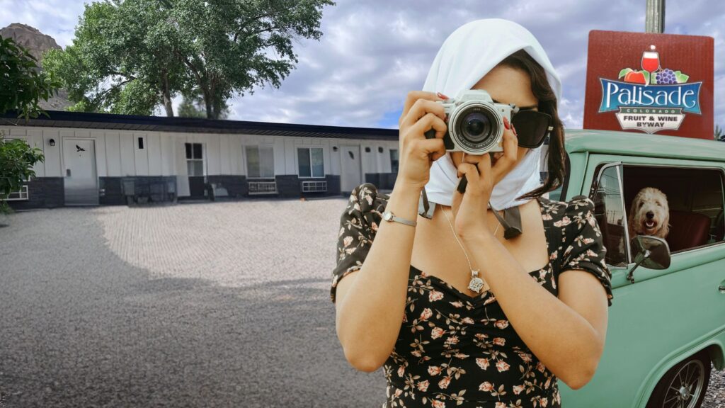 A woman with a headscarf and sunglasses snaps a photo in front of a retro hotel in Colorado. A dog peers from a green van, while a sign marks Palisade, Colorado Fruit & Wine Byway, capturing the retro travel trend.